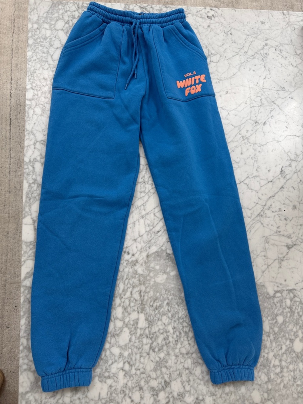 White Fox Boutique Royal Blue Kids Fleece Joggers with Orange Logo